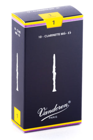 Ein rechteckiger, dunkelblauer Karton mit gelben Akzenten und dem Aufdruck "Vandoren PARIS" zeigt eine stilisierte Klarinette und die Aufschrift "10 - Clarinette Mib-Eb", welche sich auf Klarinettenblätter bezieht.