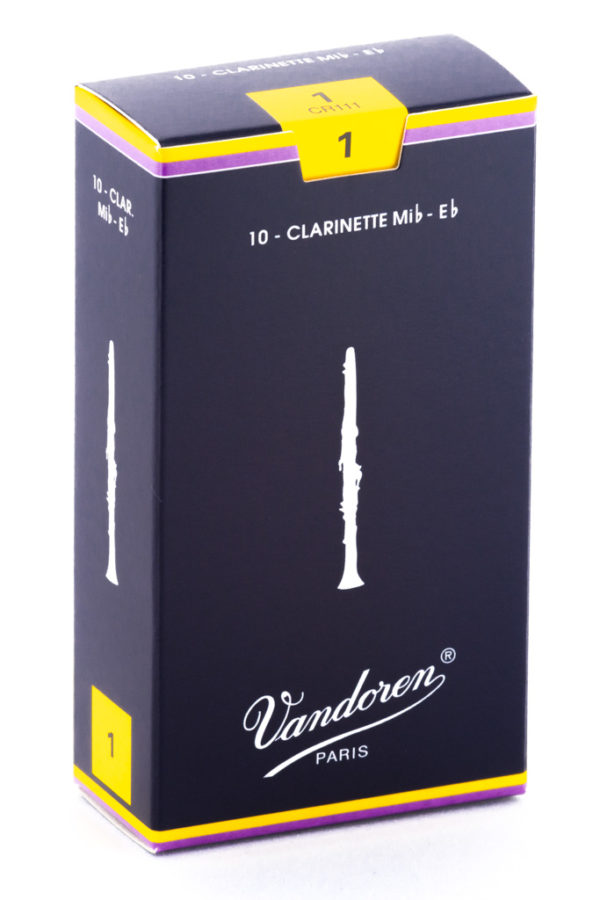 Ein rechteckiger, dunkelblauer Karton mit gelben Akzenten und dem Aufdruck "Vandoren PARIS" zeigt eine stilisierte Klarinette und die Aufschrift "10 - Clarinette Mib-Eb", welche sich auf Klarinettenblätter bezieht.