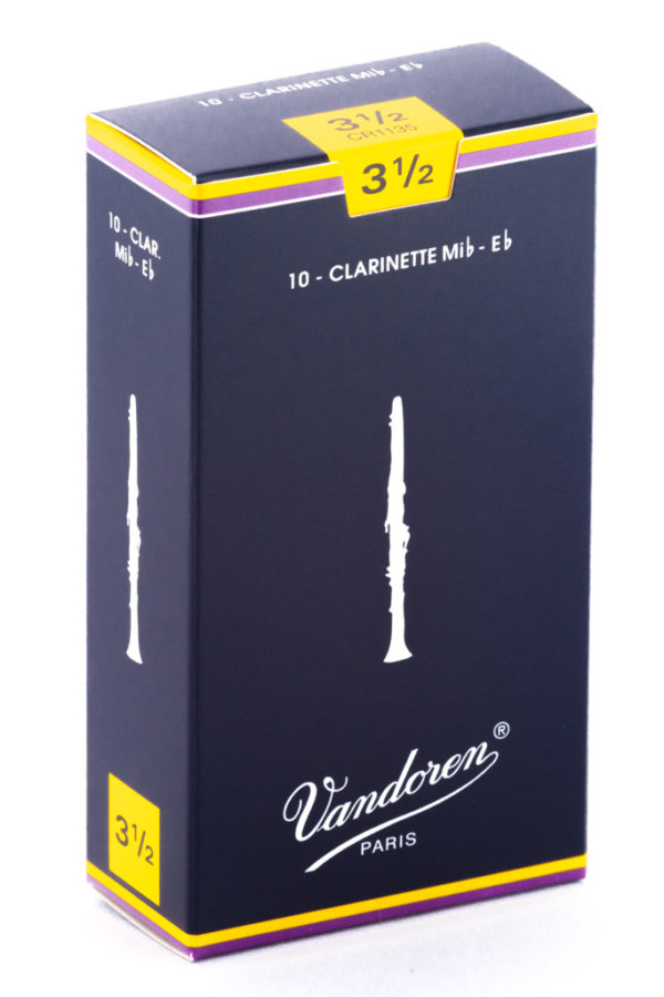 Ein dunkelblau-gelber Karton mit der Aufschrift "Vandoren Paris" und der Bezeichnung "10 - Clarinette Mib-Eb" ist vor einem weißen Hintergrund zu sehen.