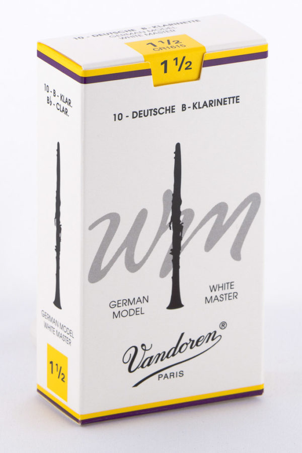 Eine weiße Pappschachtel mit gelben und violetten Akzenten, beschriftet mit "10 - DEUTSCHE B-KLARINETTE" und "Vandoren PARIS", zeigt eine stilisierte Abbildung einer Klarinette und trägt den Schriftzug "WM WHITE MASTER GERMAN MODEL" sowie die Stärke "1 1/2".