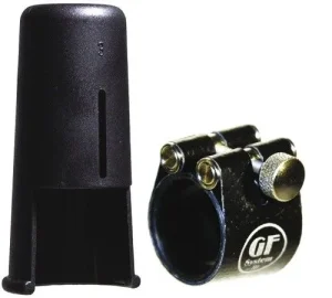 Das Bild zeigt eine schwarze GF System Blattschraube für Klarinetten zusammen mit einer schwarzen Kapsel.