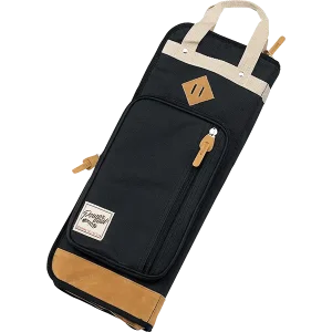 Das Bild zeigt eine schwarze Tama Sticktasche TSB24BK mit beigefarbenen Applikationen an Tragegriffen, oberem und unterem Taschenrand sowie Zierdetails.